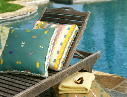 Swimsuit themed prints add a whimsical flair to this wooden chaise lounge.